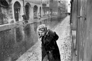 Woman walking in snow. Prague 1991