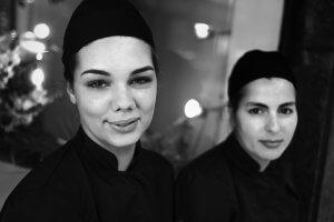 Black and white portrait of Waitresses on a break, Porto, Portugal.