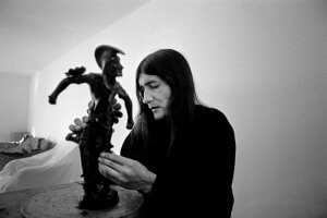 Sculptor, Michael Naranjo who was blinded in the Viet Nam war is working on one of his sculptures.