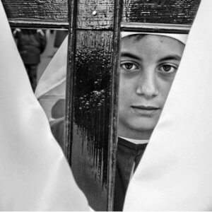 Black and white portrait of a boy. Semana Santa, Easter procession. Marbella, Spain.