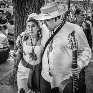 Dancer and guitar playing couple, Marbella, Spain. Walking after a performance.