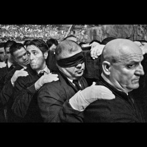 Easter procession, Semana Santa. Blindfolded man. Marbella, Spain.