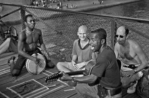 Street singers on a bridge over the river Seine, Paris France