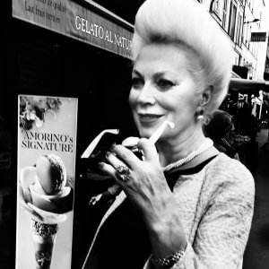 Black and white portrait of a woman with an over-styled hairdo in Paris, France.