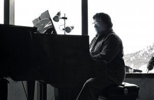 Paul Caponigro Photographer plays piano at his home in Santa Fe, New Mexico