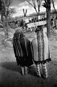 Traditional Navajo women watch a protest march in Gallup, New Mexico.