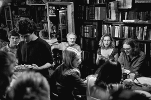 George Whitman dining with residents. Shakespeare & Co. Paris.