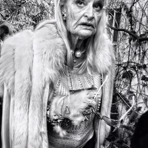 Mature woman dressed in furs and jewelry. Marbella, Spain.